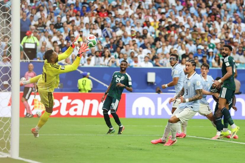 Saudi Arabia's goalkeeper #21 Mohammed Al-Owais catches the ball during the 2026 World Cup Group H football match between Saudi Arabia and Uruguay at the Miami Stadium in Miami Gardens on June 15, 2026. PATRICIA DE MELO MOREIRA / AFP