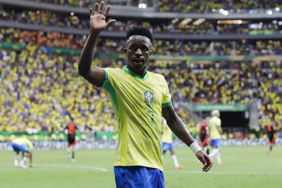 Brazil's forward #07 Vinicius Jr waves to the fans during the 2026 FIFA World Cup South American qualifiers football match between Brazil and Colombia, at the Mane Garrincha stadium in Brasilia, on March 20, 2025. Sergio Lima / AFP