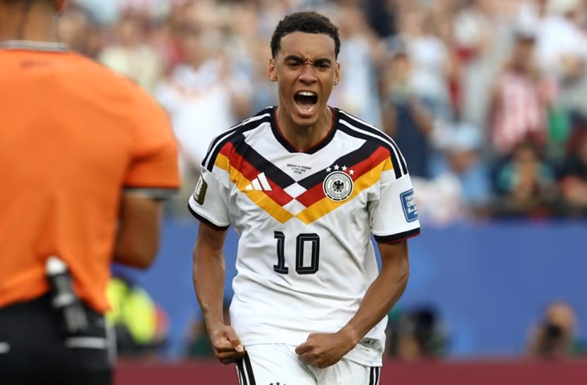 Germany's midfielder #10 Jamal Musiala reacts after scoring his penalty during the penalty shootout of the 2026 World Cup round of 32 football match between Germany and Paraguay at the Boston Stadium in Foxborough on June 29, 2026. FRANCK FIFE / AFP
