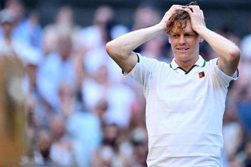 Italy's Jannik Sinner reacts to beating Germany's Alexander Zverev (R) for winning their men's singles final tennis match on the fourteenth day of the 2026 Wimbledon Championships at The All England Lawn Tennis and Croquet Club in Wimbledon, southwest London, on July 12, 2026. Kirill KUDRYAVTSEV / AFP
