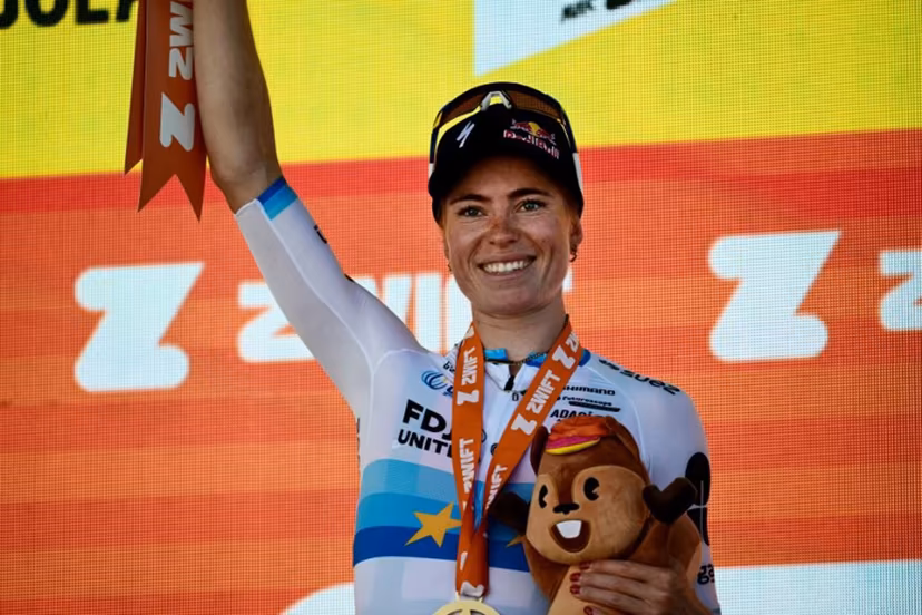 FDJ-SUEZ's Dutch rider Demi Vollering celebrates on the podium after winning the 5th (out of 9) stage of the fifth edition of the Women's Tour de France cycling race, 140 km from Macon to Belleville-en-Beaujolais, in Belleville-en-Beaujolais, central France on August 5, 2026. NICOLAS TUCAT / AFP