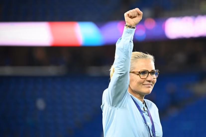 England's Dutch coach Sarina Wiegman punches the air after England won the UEFA Women's Euro 2025 final football match between England and Spain at the St. Jakob-Park Stadium in Basel, on July 27, 2025. England beat Spain 3-1 on penalties to win the Women's Euro 2025 final. SEBASTIEN BOZON / AFP