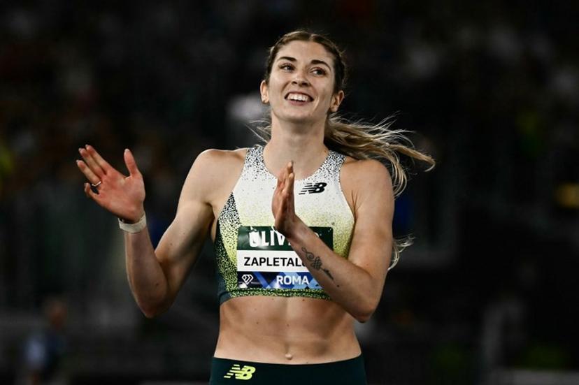 Slovakia's Emma Zapletalova celebrates after winning in the women's 400m Hurdles during the IAAF Diamond League athletics meeting, at the Olympic Stadium, in Rome on June 4, 2026. Filippo MONTEFORTE / AFP