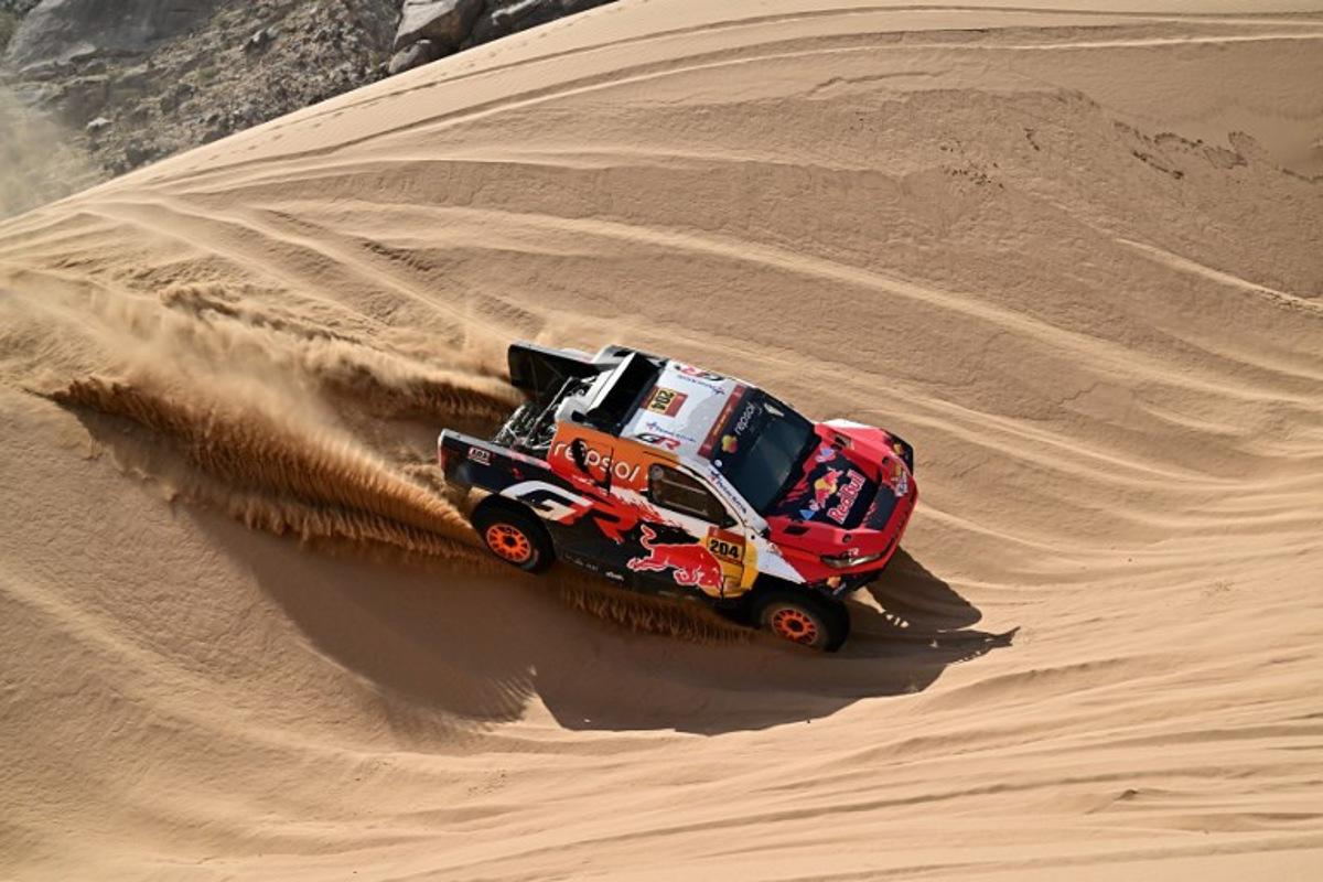 Toyota Gazoo Racing W2rc's Australian driver Toby Price and Spanish copilot Armand Monleon compete in Stage 12 of the 48th edition of the Dakar Rally 2026, between al-Henakiyah and Yanbu, Saudi Arabia, on January 16, 2026. Giuseppe CACACE / AFP