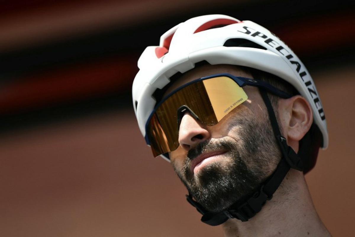 Team Soudal-Quick Step's French rider Valentin Paret-Peintre is presented on stage before the start of the Vuelta a Espana, a 183 km race between Torino - Reggia di Venaria and Novara, in Italy's Piemonte region, on August 23, 2025. Marco BERTORELLO / AFP