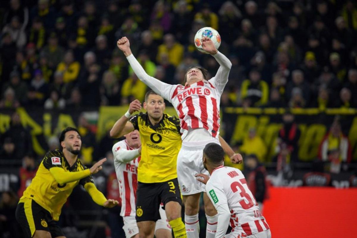 Dortmund's German defender #03 Waldemar Anton and FC Cologne's Belgian-Spanish midfielder #17 Alessio Castro-Montes vie for the ball during the German first division Bundesliga football match between BVB Borussia Dortmund and 1 FC Cologne in Dortmund, Germany on October 25, 2025. Sascha Schuermann / AFP