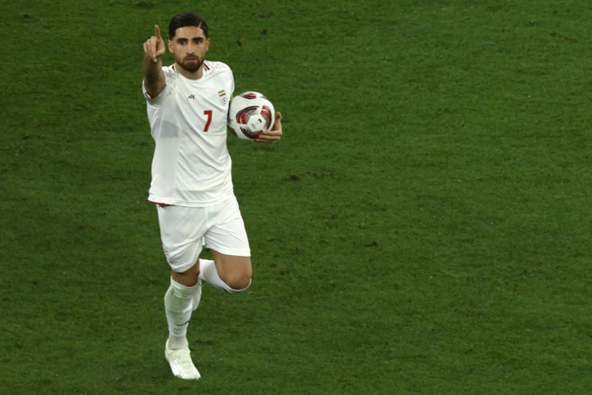 Iran's midfielder #07 Alireza Jahanbakhsh celebrates after scoring his team's second goal from the penalty spot during the Qatar 2023 AFC Asian Cup semi-final football match between Iran and Qatar at al-Thumama Stadium in Doha on February 7, 2024. KARIM JAAFAR / AFP