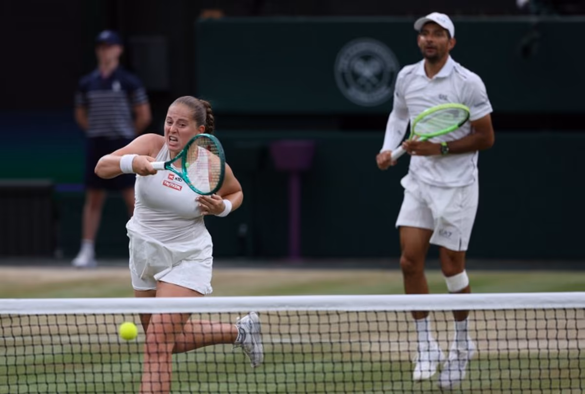 El Salvador's Marcelo Arevalo (R) and Latvia's Jelena Ostapenko play against Australia's players Marc Polmans and Storm Hunter during their mixed's doubles final tennis match on the eleventh day of the 2026 Wimbledon Championships at The All England Lawn Tennis and Croquet Club in Wimbledon, southwest London, on July 9, 2025. Adrian Dennis / AFP