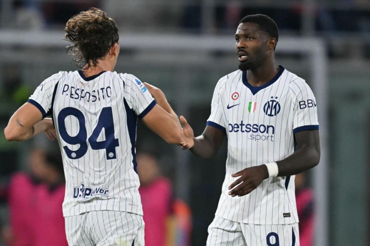 Inter Milan's French forward #9 Marcus Thuram celebrates scoring his team's first goal with Inter Milan's Italian forward #94 Pio Esposito during the Italian Serie A football match between Bologna and Inter Milan at the Renato Dall'Ara stadium in Bologna on October 17, 2026. Stefano RELLANDINI / AFP