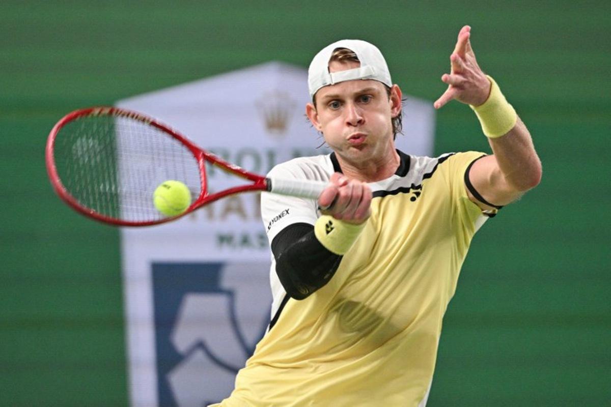 Belgium's Zizou Bergs hits a return to Spain's Carlos Alcaraz during their men's singles match at the Shanghai Masters tennis tournament in Shanghai on October 12, 2026. Hector RETAMAL / AFP