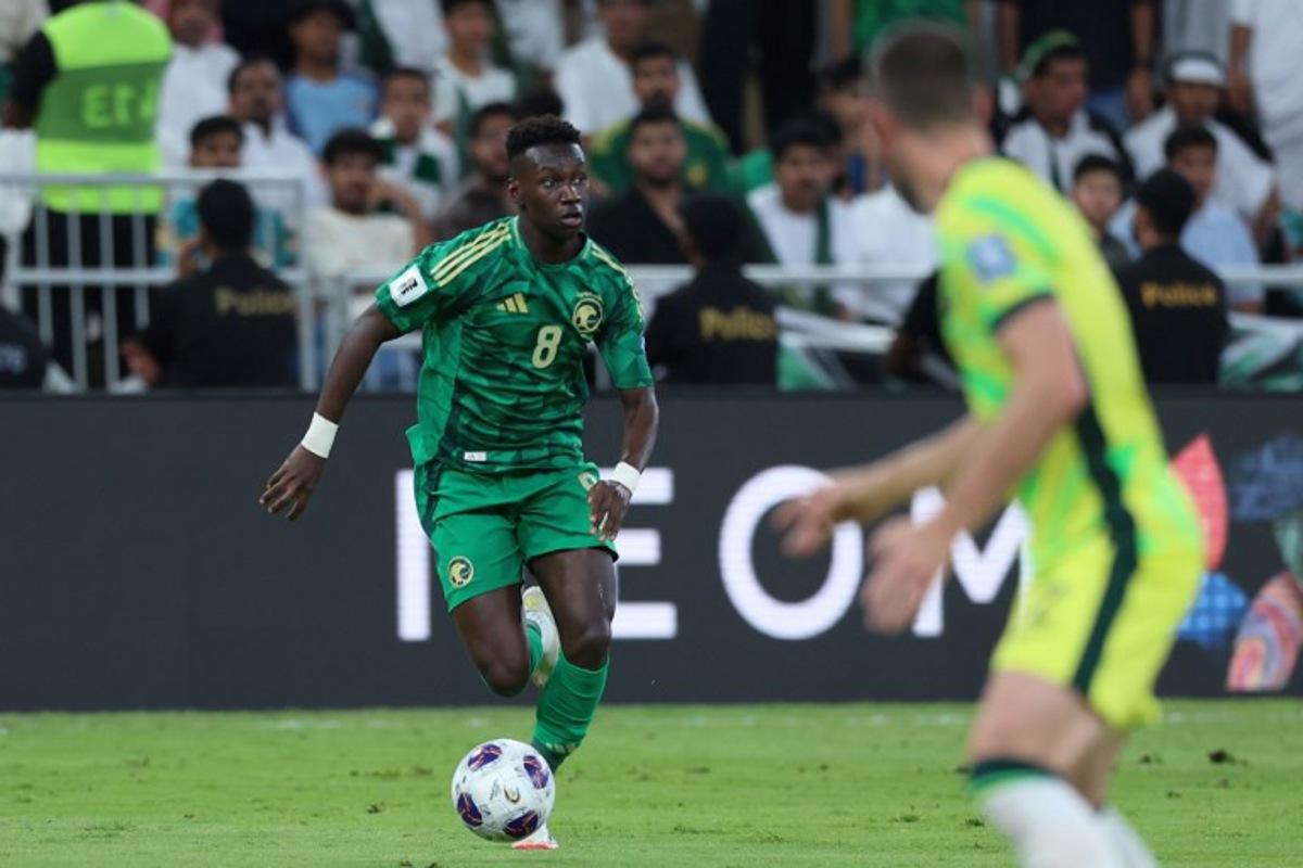 Saudi Arabia's midfielder #8 Marwan Al-Sahafi runs with the ball during the FIFA World Cup 2026 Asia zone qualifiers group C football match between Saudi Arabia and Australia at the King Abdullah Sport City in Jeddah on June 10, 2025. Abdel Ghani BASHIR / AFP