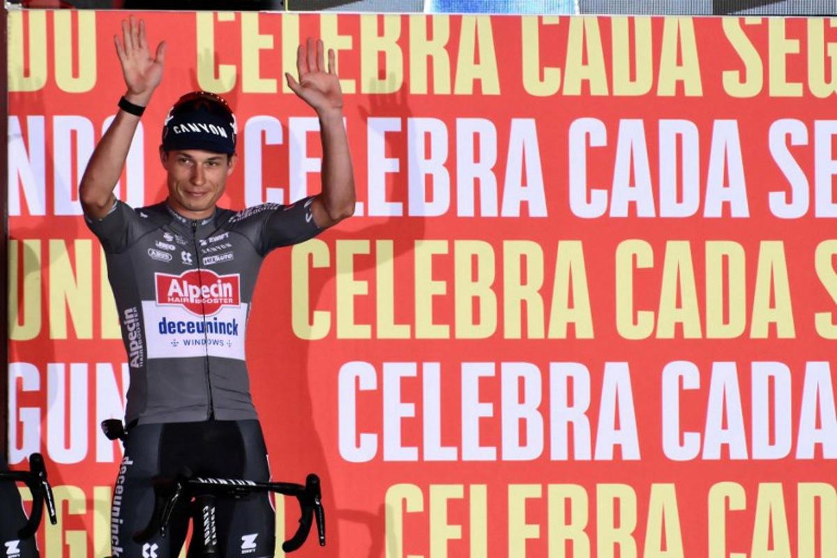 Team Alpecin's Belgian rider Jasper Philipsen waves during the official teams presentation of the 80th edition of 'La Vuelta' cycling tour of Spain, in Torino, Italy on August 21, 2025. Marco BERTORELLO / AFP