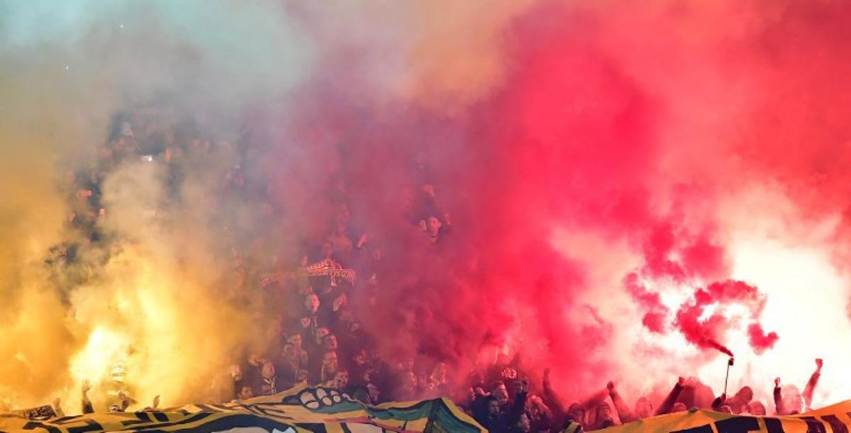 Dortmund's soccer fans use fireworks during the German first division Bundesliga football match Hertha BSC Berlin vs BVB Borussia Dortmund, in Berlin, western Germany, on January 19, 2018. Tobias SCHWARZ / AFP