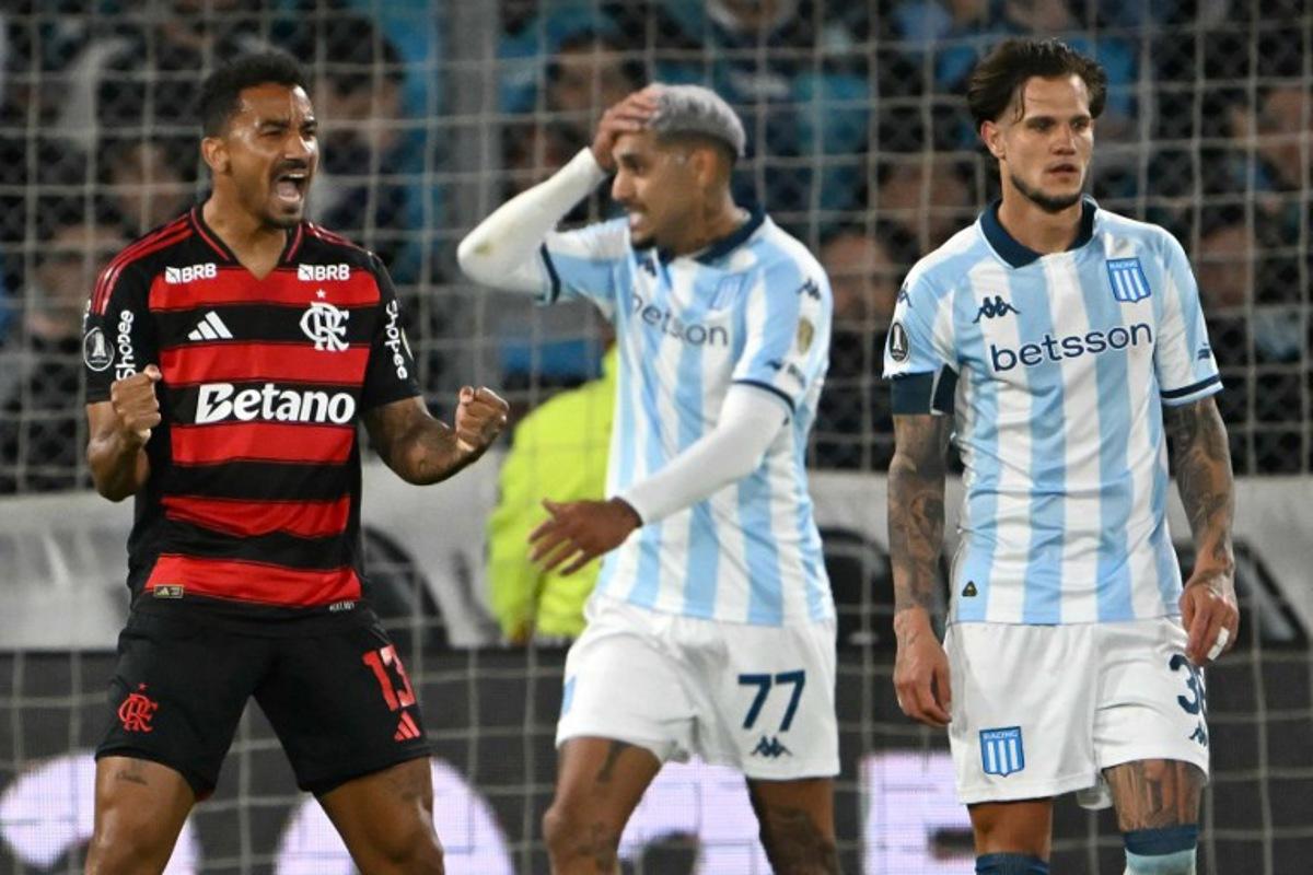 Flamengo's defender #13 Danilo celebrates next to Racing's midfielder #36 Bruno Zuculini during the Copa Libertadores semifinal second leg football match between Argentina's Racing and Brazil's Flamengo at the Presidente Juan Domingo Peron - El Cilindro stadium in Avellaneda, Buenos Aires province, on October 29, 2025. Luis ROBAYO / AFP