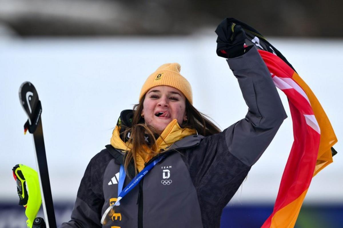 Silver medallist Germany's Emma Aicher celebrates after the women's team combined event during the Milano Cortina 2026 Winter Olympic Games at the Tofane Alpine Skiing Centre in Cortina d'Ampezzo on February 10, 2026. Marco BERTORELLO / AFP