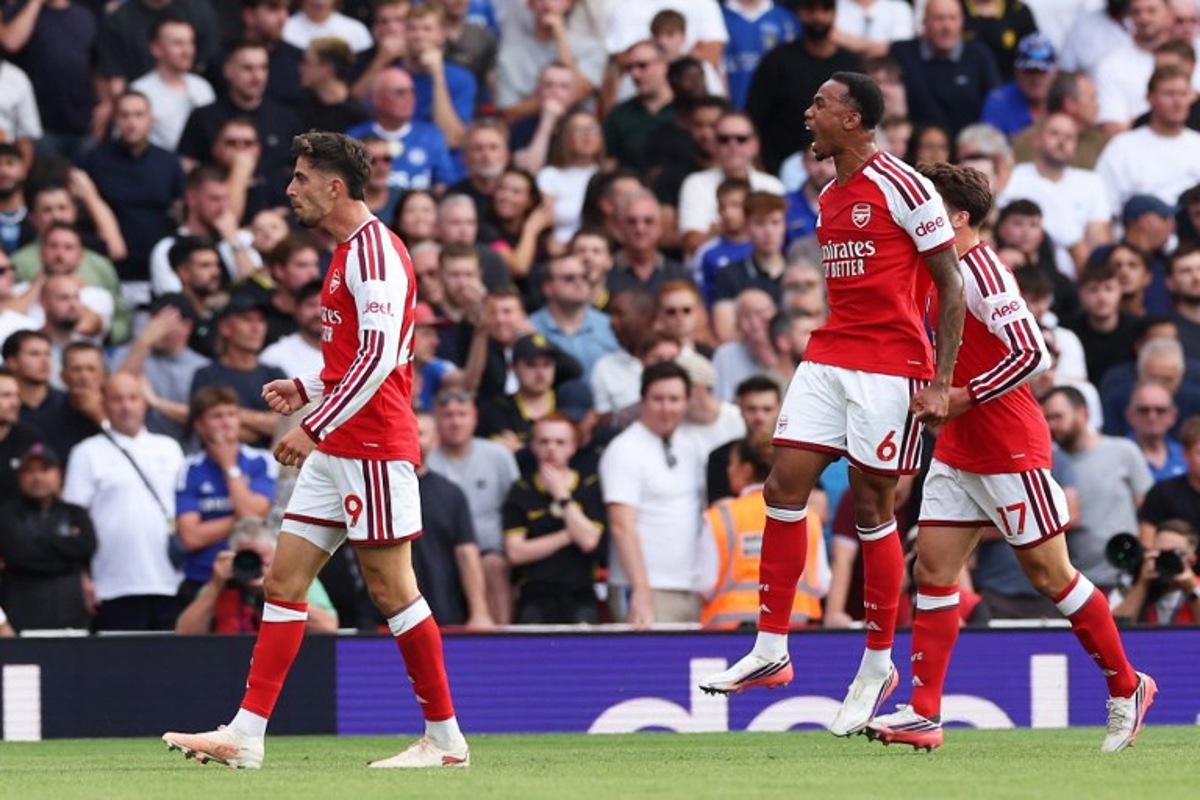 Arsenal's German midfielder #29 Kai Havertz (L) scores the team's first goal during the English Premier League football match between Arsenal and Chelsea at the Emirates Stadium in London on September 6, 2026. Adrian Dennis / AFP