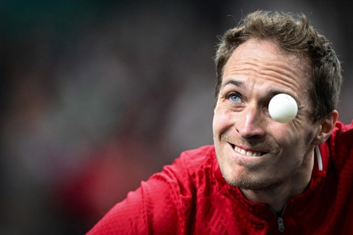 Belgium's Cedric Nuytinck eyes the ball as he plays a return against Sweden's Truls Moregard during their men's table tennis singles round of 64 at the Paris 2024 Olympic Games at the South Paris Arena in Paris on July 27, 2024. JUNG Yeon-je / AFP