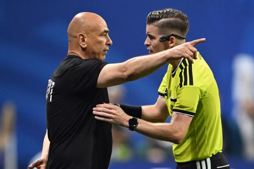 Egypt's head coach Hossam Hassan speaks with French referee Francois Letexier during the 2026 World Cup round of 16 football match between Argentina and Egypt at Atlanta Stadium in Atlanta on July 7, 2026. ROBERTO SCHMIDT / AFP