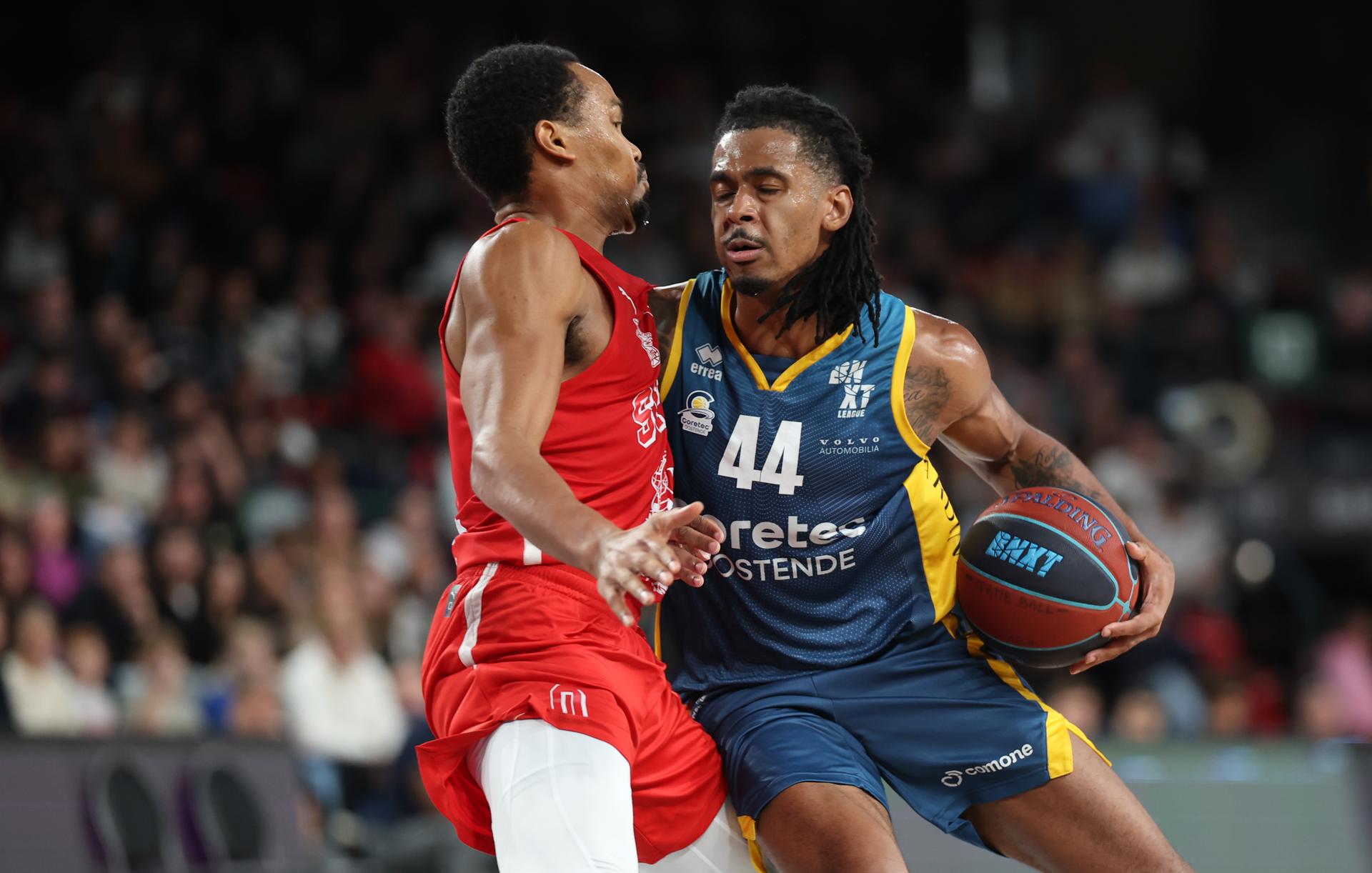 Spirou's Nigel Hawkins and Oostende's Adam Miller fight for the ball during a basketball match between Spirou Charleroi and BC Oostende, Friday 23 October 2026 in Charleroi, on day 4 of the 'BNXT League' Belgian and Dutch first division basket championship. BELGA PHOTO VIRGINIE LEFOUR