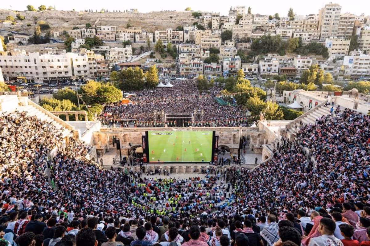 Jordanian football fans gather to watch on giant screens their national team's 2026 World Cup Group J football match against Algeria at Amman's 2nd-century Roman amphitheatre early on June 23, 2026. George SAIF / AFP