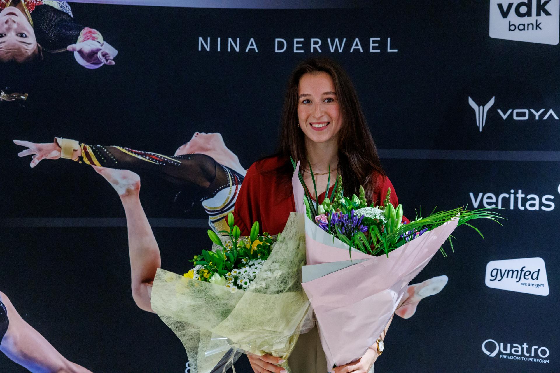Belgian gymnast Nina Derwael receives flowers at a press conference regarding her retirement as a professional athlete, Wednesday 16 July 2025 in Gent. 2020 Olympic champion Derwael announced her retirement from the sport. BELGA PHOTO KURT DESPLENTER