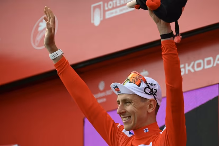 Overall race leader, UAE Team Emirates - XRG team's Slovenian rider Tadej Pogacar, gestures on the podium after the seventh stage of the Vuelta a Espana 2026, a 149,8 km race between Vall d'Alba and Aramon Valdelinares on August 28, 2026. JOSE JORDAN / AFP