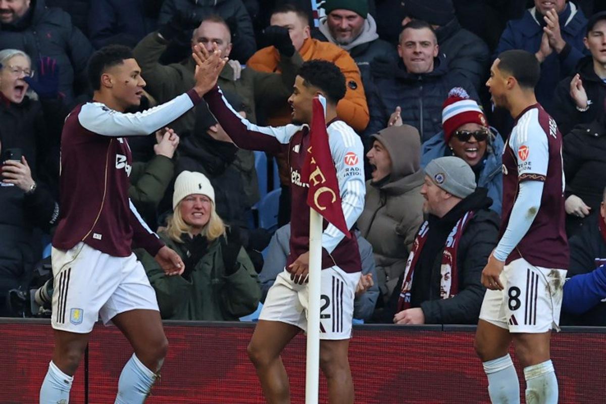 Aston Villa's English striker #11 Ollie Watkins (L) celebrates with teammates after scoring the opening goal of the English Premier League football match between Aston Villa and Nottingham Forest at Villa Park in Birmingham, central England on January 3, 2026. Darren Staples / AFP