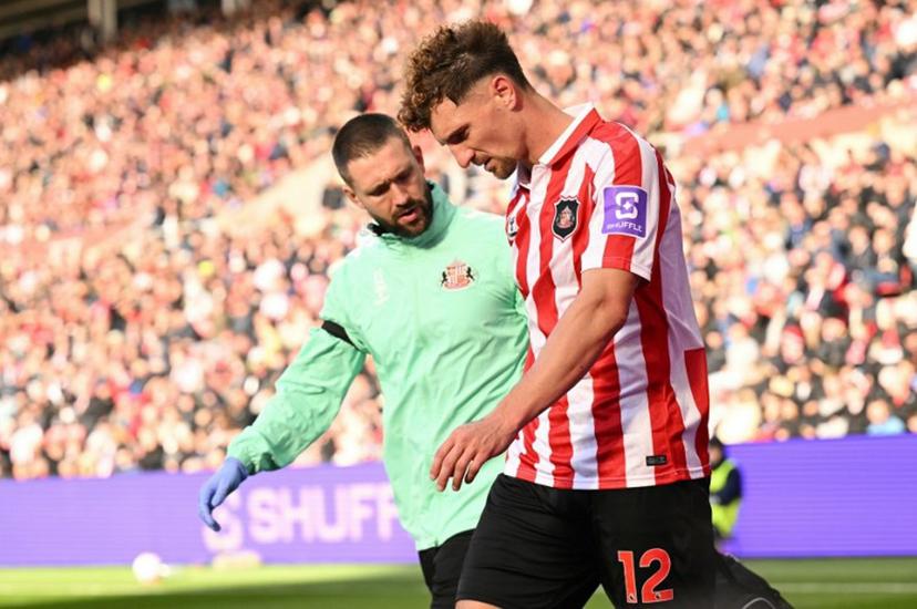 Sunderland's Belgian defender #12 Thomas Meunier leaves the pitch injured during the English Premier League football match between Sunderland and Brighton and Hove Albion at The Stadium of Light in Sunderland in north east England on October 10, 2026. Oli SCARFF / AFP