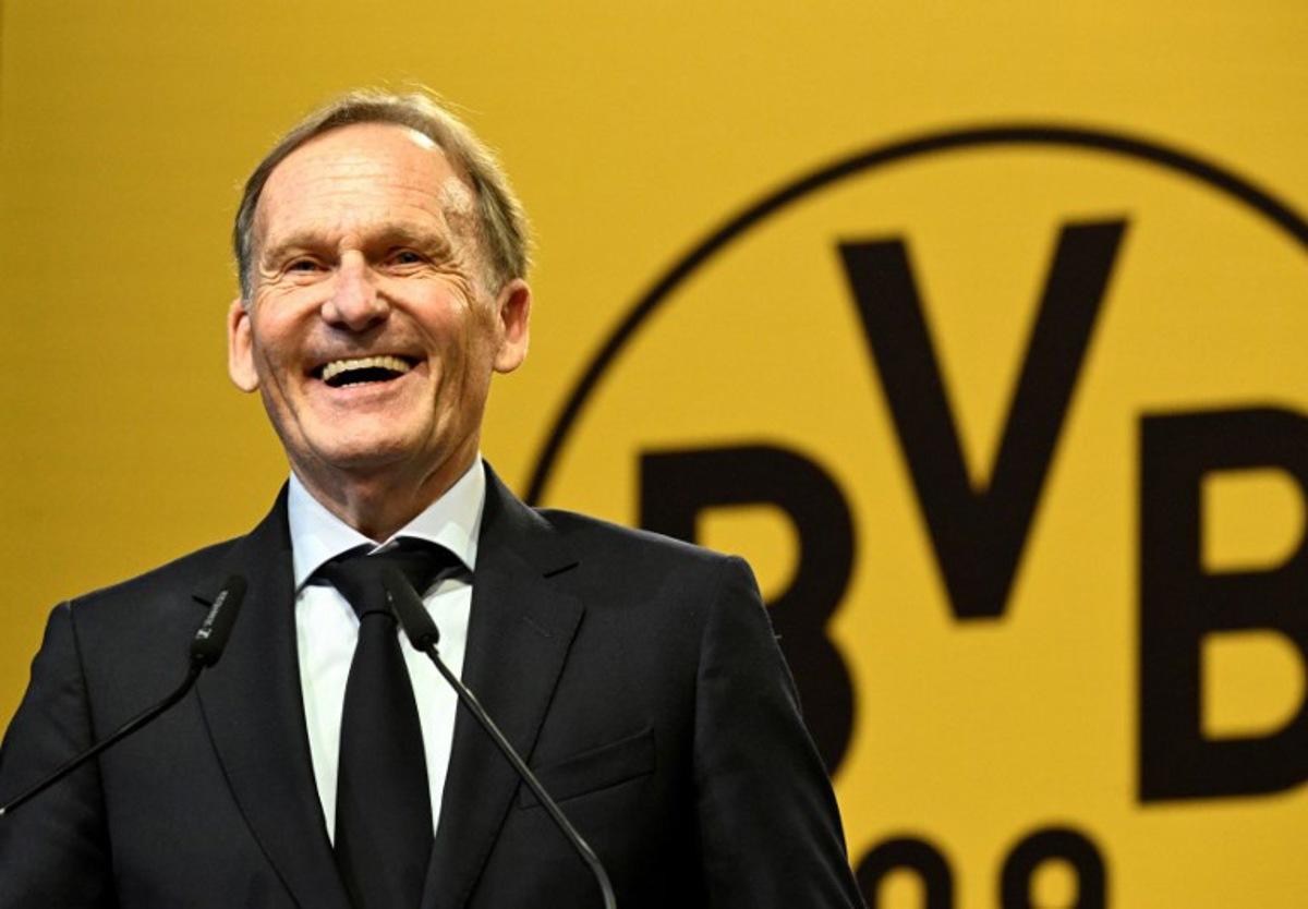 Borussia Dortmund's CEO Hans-Joachim Watzke delivers a speech during the German first division Bundesliga football club's annual general meeting in Dortmund, western Germany on November 23, 2025. After 20 years as managing director, Watzke aims to be elected as president of the club to replace current president Reinhold Lunow. Ina FASSBENDER / AFP
