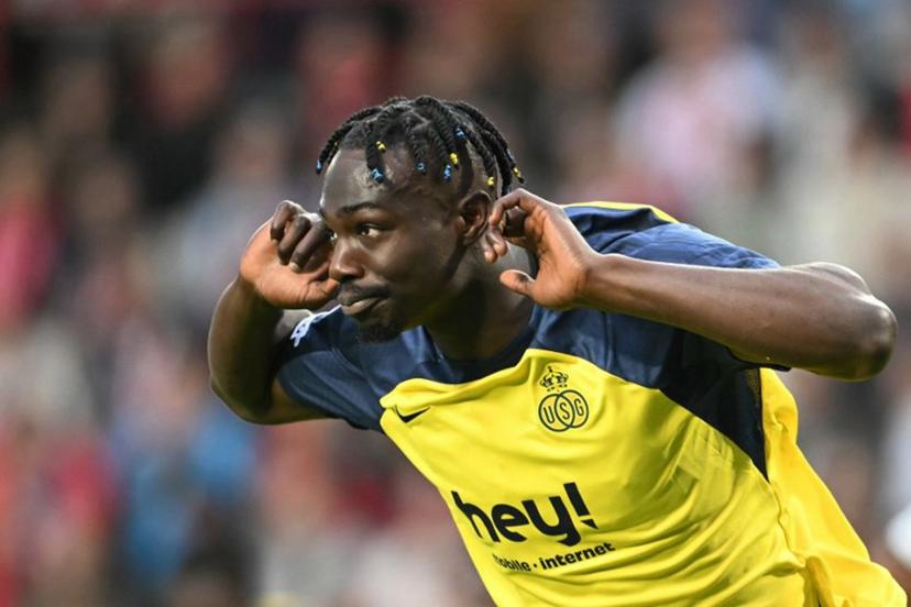 Union's Canadian forward #12 Promise David celebrates scoring his team's first goal from the penalty spot during the UEFA Champions League first round day 1 football match between PSV Eindhoven and Union Saint-Gilloise at the Philips Stadium, in Eindhoven on September 16, 2025. NICOLAS TUCAT / AFP