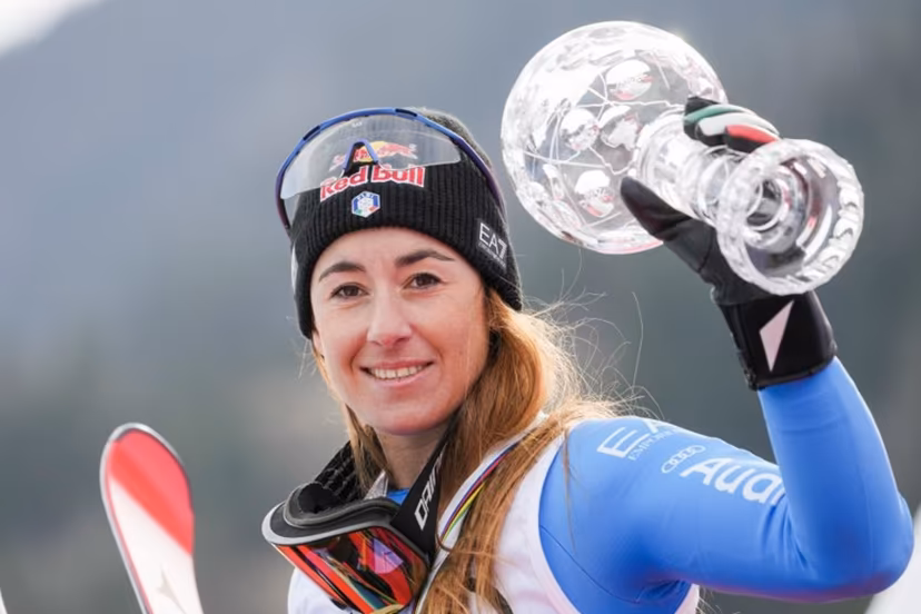 Overall winner Italy's Sofia Goggia celebrates with the Super-G overall trophy after the women's FIS Ski World Cup super-G event in Kvitfjell, near Lillehammer, Norway on March 22, 2026. Cornelius Poppe / NTB / AFP