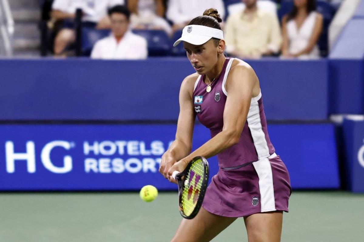 Belgium's Elise Mertens hits a return to Japan's Naomi Osaka in their women's singles third round tennis match on day seven of the US Open tennis tournament at the USTA Billie Jean King National Tennis Center in New York City on September 5, 2026. kena betancur / AFP
