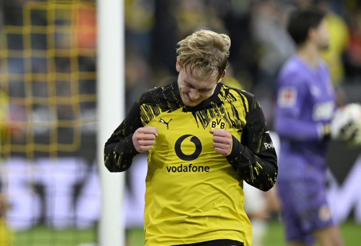 Dortmund's German midfielder #10 Julian Brandt celebrates after scoring the 1-0 goal during the German first division Bundesliga football match between BVB Borussia Dortmund and FC St Pauli in Dortmund, western Germany, on January 17, 2026. INA FASSBENDER / AFP