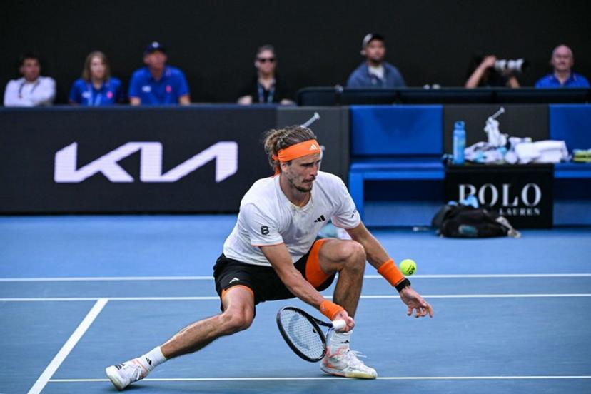 Germany's Alexander Zverev hits a shot against Spain's Carlos Alcaraz during their men's singles semi-final match on day thirteen of the Australian Open tennis tournament in Melbourne on January 30, 2026. WILLIAM WEST / AFP