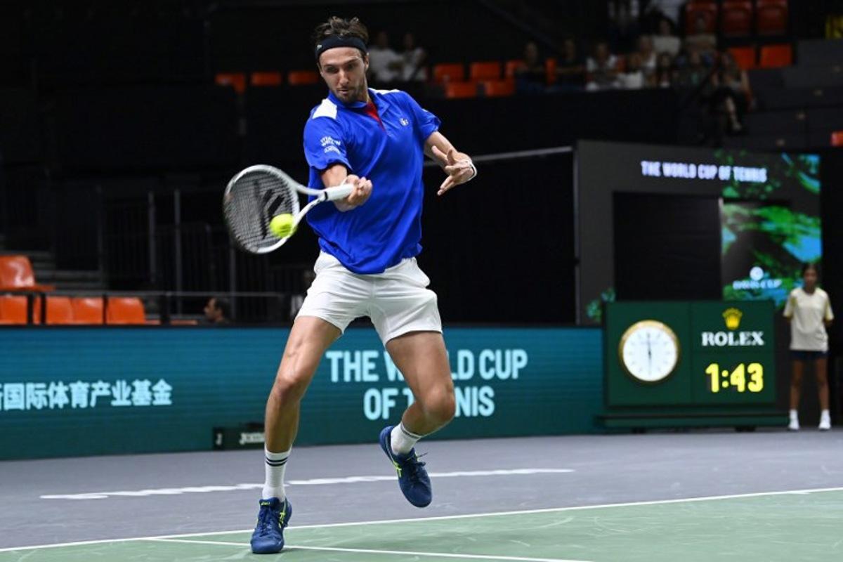 France's Arthur Rinderknech returns a ball against Czech Republic's Jakub Mensik during the group stage men's singles match between Czech Republic and France of the Davis Cup tennis tournament at the Fuente San Luis Sports Hall in Valencia on September 14, 2024. JOSE JORDAN / AFP
