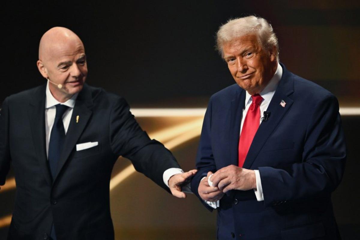 (L/R) FIFA President Gianni Infantino and US President Donald Trump participate in the draw for the 2026 FIFA Football World Cup taking place in the US, Canada and Mexico, at the Kennedy Center, in Washington, DC, on December 5, 2025. Mandel NGAN / POOL / AFP