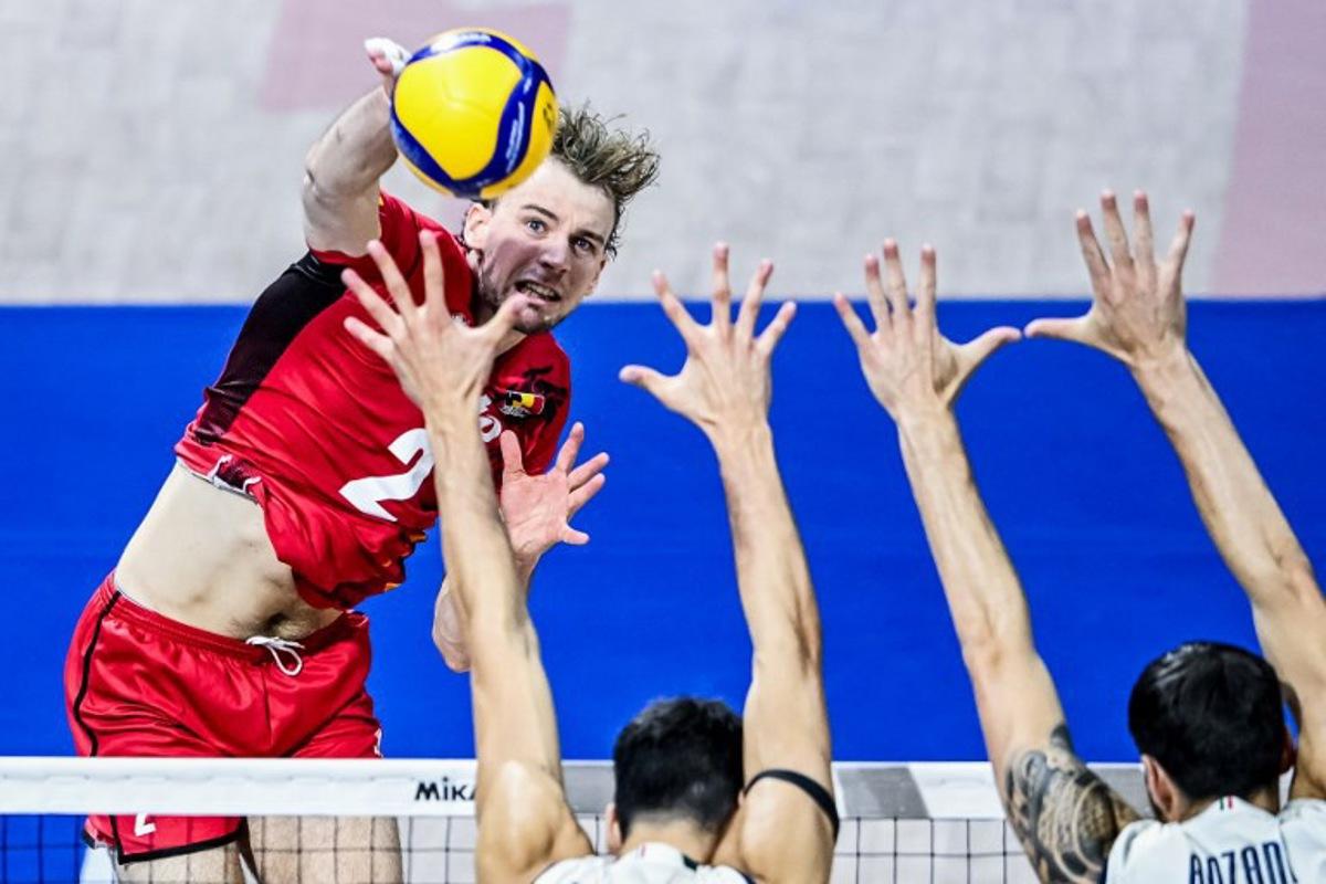 Belgium's Ferre Reggers attempts to score against Italy during the 2025 Men's Volleyball World Championship at the Araneta Coliseum in Quezon City on September 16, 2025. SHERWIN VARDELEON / AFP