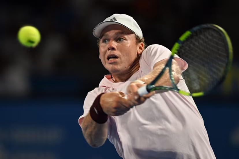 USA's Alex Michelsen plays a shot to Spain's Carlos Alcaraz during their men's singles tennis match at the ATP Tour Japan Open Tennis Championships at the Ariake Tennis Forest Park in Tokyo on October 1, 2026. Rie KIKUCHI / AFP