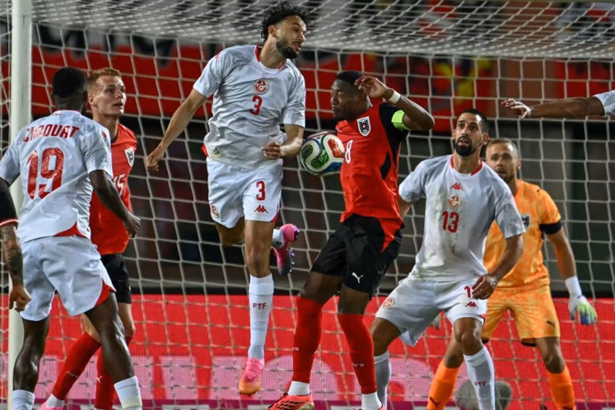 Austria's defender #08 David Alaba and Tunisia's defender #03 Montassar Talbi vie for the ball during the friendly football match between Austria and Tunisia in Vienna, Austria on June 1, 2026 ahead of the 2026 FIFA World Cup football tournament. Joe Klamar / AFP