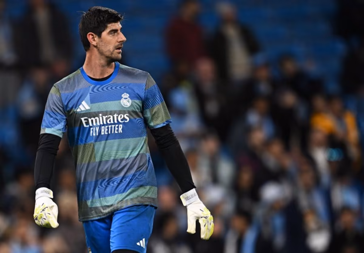 Real Madrid's Belgian goalkeeper #01 Thibaut Courtois warms up ahead of the UEFA Champions League, round of 16 second leg football match between Manchester City and Real Madrid at the Etihad Stadium in Manchester, north west England, on March 17, 2026. Paul ELLIS / AFP