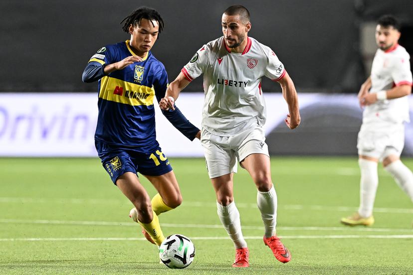 STVV's Nelson Ishiwatari and Iberia's Amiran Dzagania pictured in action during a soccer game between Belgian Sint-Truidense VV and Georgian FC Iberia 1999 Tbilisi, Thursday 15 October 2026 in Sint-Truiden, the opening match of the UEFA Conference League league phase. BELGA PHOTO JILL DELSAUX