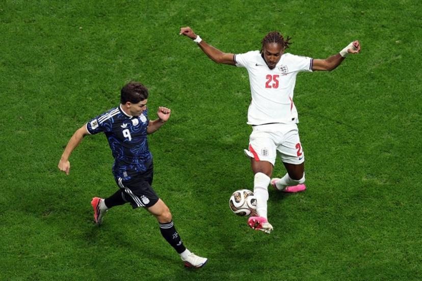 England's defender #25 Djed Spence and Argentina's forward #09 Julian Alvarez fight for the ball during the 2026 World Cup football tournament semi-final match between England and Argentina at the Atlanta Stadium in Atlanta on July 15, 2026. PATRICIA DE MELO MOREIRA / AFP