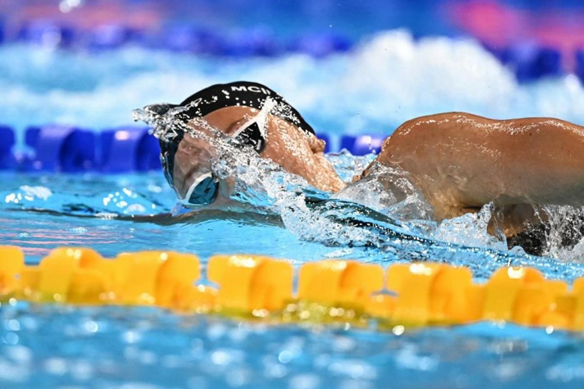 Canada's swimmer Summer Mcintosh competes in the final of the women's 400m freestyle swimming event during the 2025 World Aquatics Championships in Singapore on July 27, 2025. MANAN VATSYAYANA / AFP