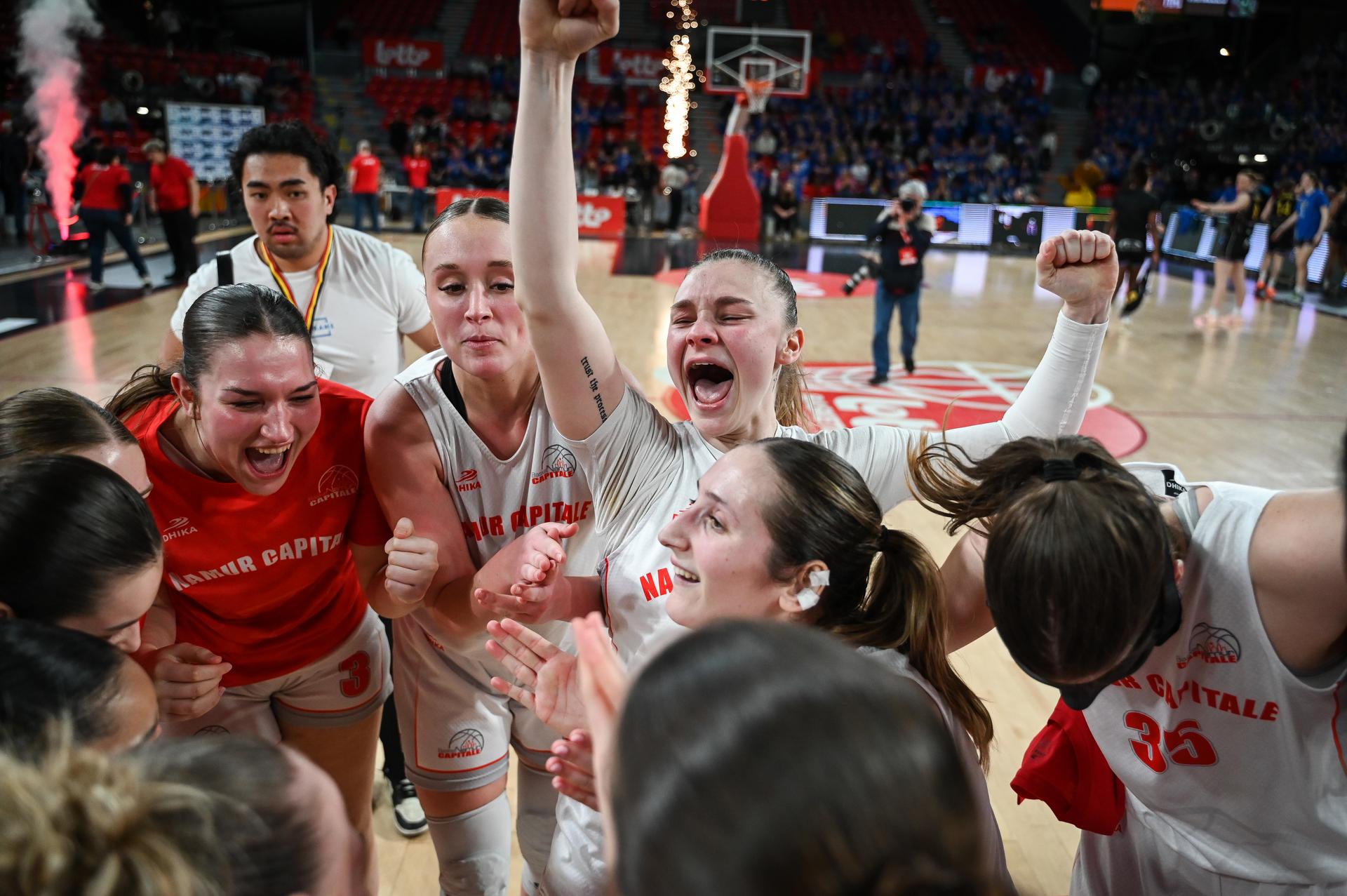 Namur's players celebrate with Namu's fans after winning a basketball match between Royal Castors Braine and Basket Namur Capitale, Sunday 22 March 2026 in Charleroi, the final of the women's Belgian 2026 Basketball Cup. BELGA PHOTO ELIAS ROM