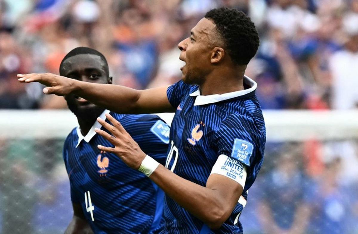 France's forward #10 Kylian Mbappe (R) celebrates scoring his team's first goal during the 2026 World Cup Group I football match between France and Iraq at the Philadelphia Stadium in Philadelphia on June 22, 2026. Jewel SAMAD / AFP