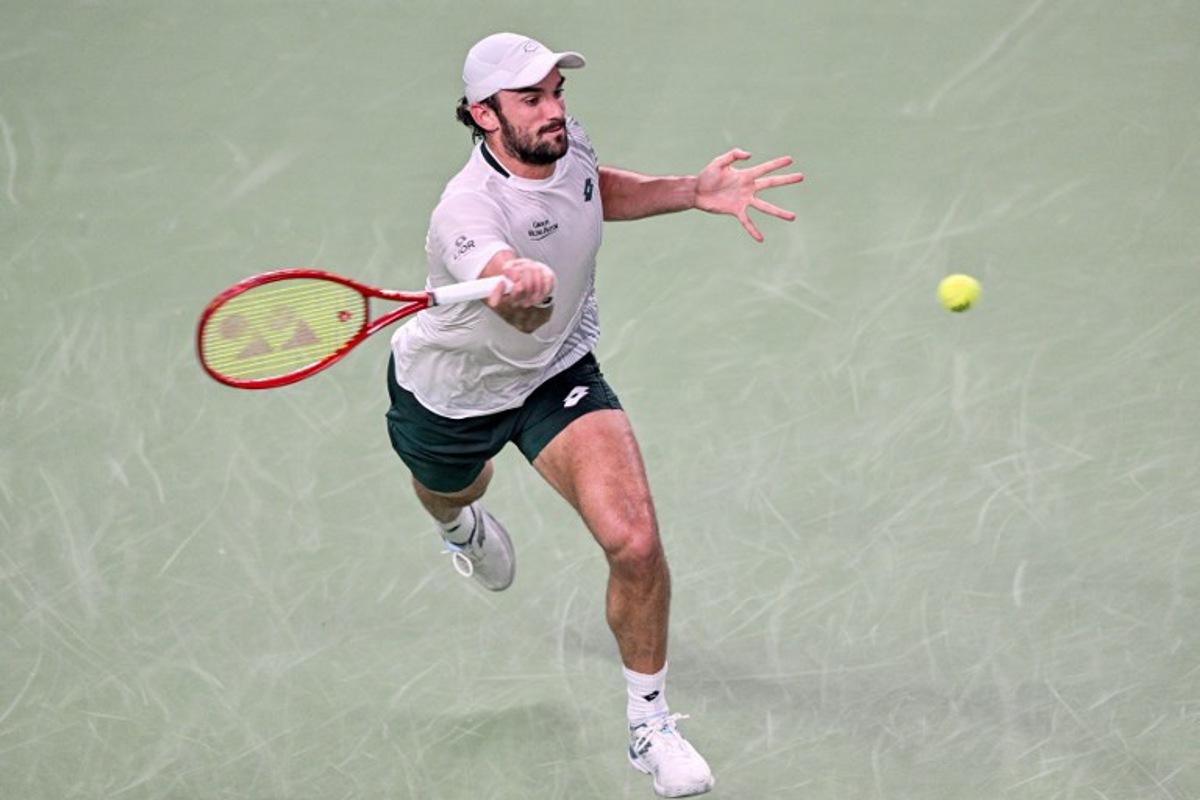 Monaco's Valentin Vacherot hits a return to USA's Tommy Paul during their men's singles match at the Shanghai Masters tennis tournament in Shanghai on October 12, 2026. Hector RETAMAL / AFP