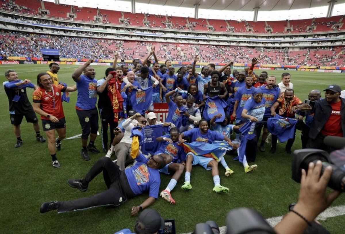 DR Congo players and coaching staff celebrate after winning the match and qualifying for the World Cup during the 2026 FIFA World Cup qualifiers final playoff football match between the Democratic Republic of the Congo and Jamaica at the Akron Stadium in Zapopan, Jalisco state, Mexico, on March 31, 2026. Ulises Ruiz / AFP