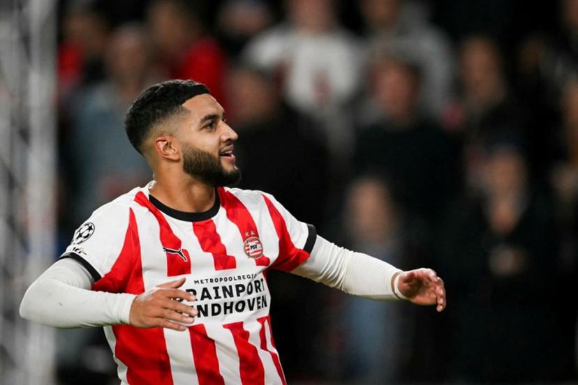 PSV Eindhoven's Moroccan midfielder #34 Ismael Saibari celebrates after scoring his team second goal during the UEFA Champions League, league phase football match between PSV Eindhoven and Napoli at the Philips Stadium, in Eindhoven, on October 21, 2025. NICOLAS TUCAT / AFP