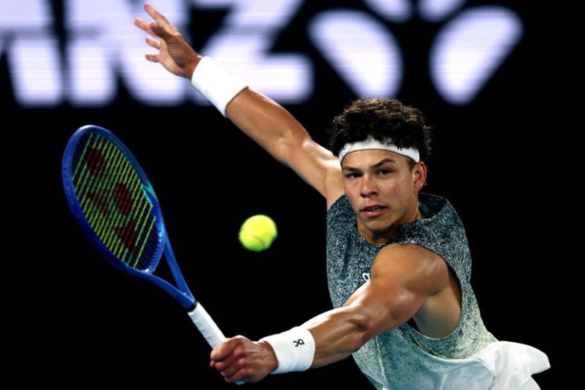 USA's Ben Shelton hits a return to Italy's Jannik Sinner during their men's singles quarter-final match on day eleven of the Australian Open tennis tournament in Melbourne on January 28, 2026. IZHAR KHAN / AFP
