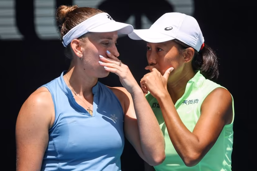 Belgium's Elise Mertens (L) talks to partner China's Zhang Shuai during their women's doubles final match against Kazakhstan's Anna Danilina and Serbia's Aleksandra Krunic on day fourteen of the Australian Open tennis tournament in Melbourne on January 31, 2026. DAVID GRAY / AFP